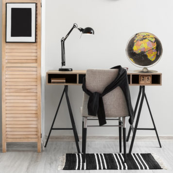Modern,Workplace,With,Black,Lamp,Near,Light,Wall