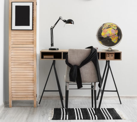 Modern,Workplace,With,Black,Lamp,Near,Light,Wall