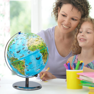 Portrait,Of,Mother,Helping,Her,Daughter,With,Homework Portrait,Of,Mother,Helping,Her,Daughter,With,Homework